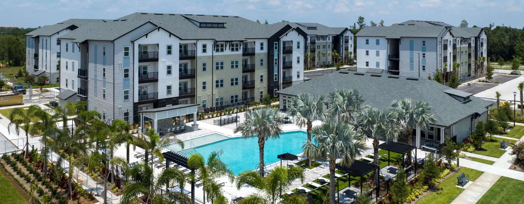Resort-style swimming pool at Madison Waterstar luxury apartments near Sunset Walk Kissimmee Florida.